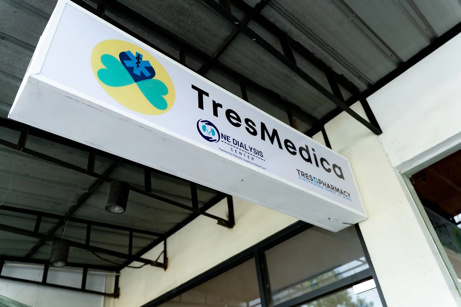 TresMedica, One Dialysis Center and TresRx Pharmacy signage at the head office